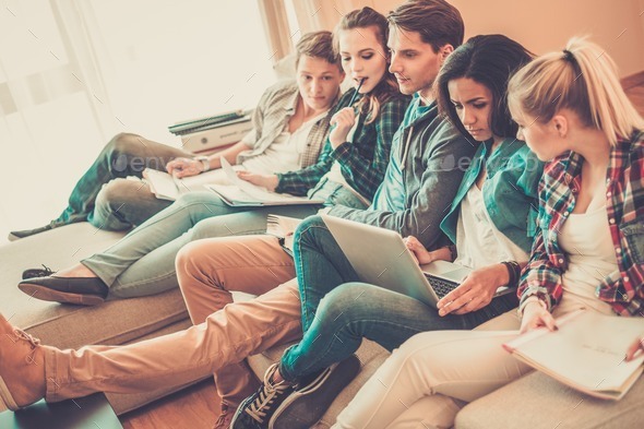 Group of students preparing for exams in apartment interior (Misc) Photo Download