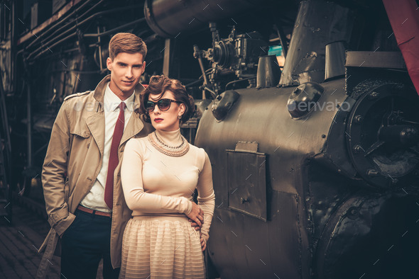 Vintage style couple near steam locomotive (Misc) Photo Download