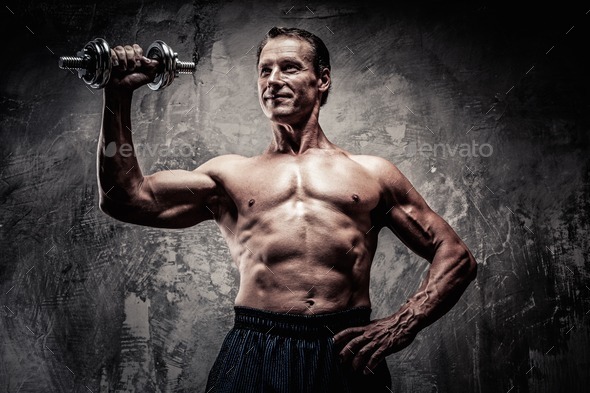 Handsome muscular man with dumbbell (Misc) Photo Download