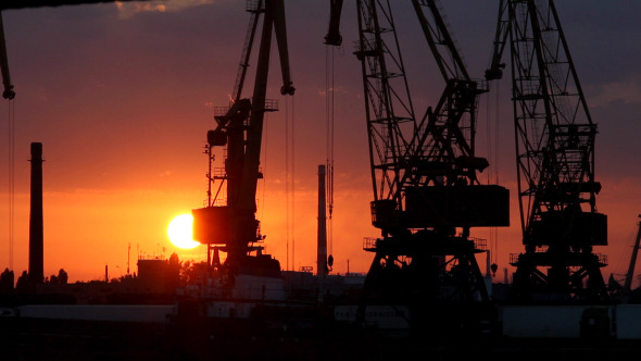 A Cargo Cranes in the Port at Sunset A Cargo Cranes in the Port at Sunset