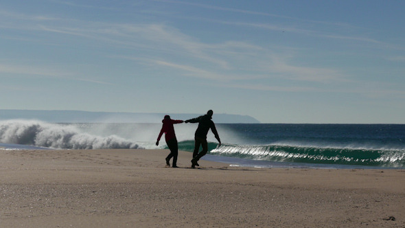 Happy Middle-aged Couple Walking on Beach Happy Middle-aged Couple Walking on Beach