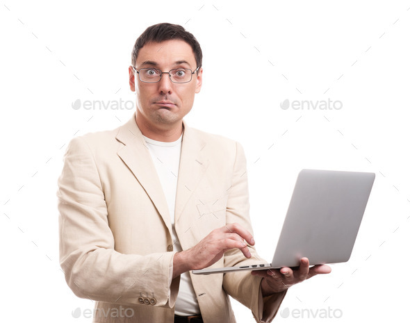 surprised man wearing suit and glasses with laptop (Misc) Photo Download