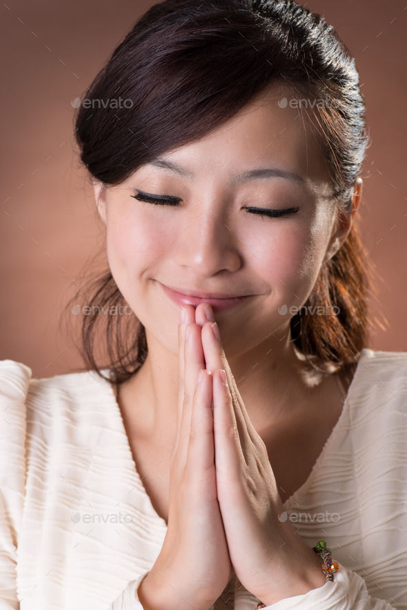 Asian woman praying