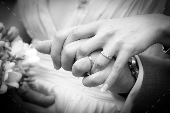 Young married couple holding hands (Misc) Photo Download