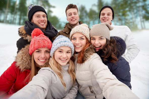 group of smiling friends taking selfie outdoors (Misc) Photo Download