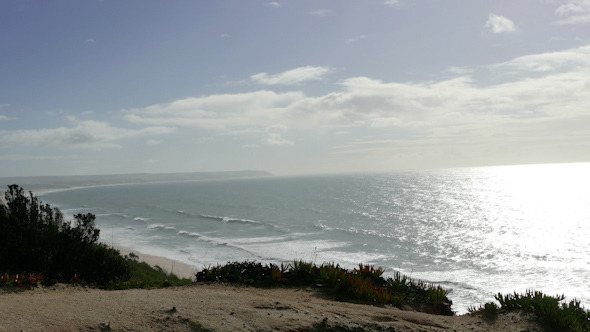 Man Climb on a Cliff Above the Ocean Man Climb on a Cliff Above the Ocean