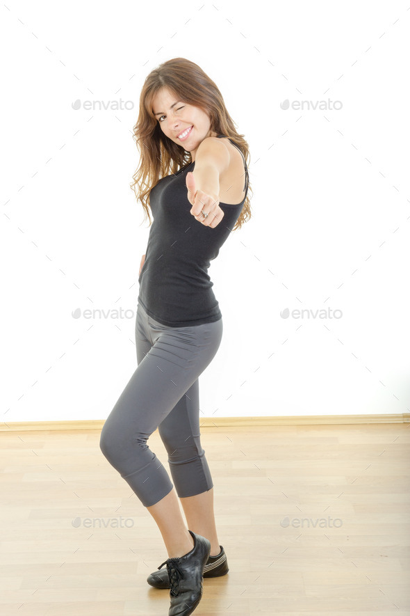 Smiling beautiful sporty fit athletic girl or woman with thumb u (Misc) Photo Download