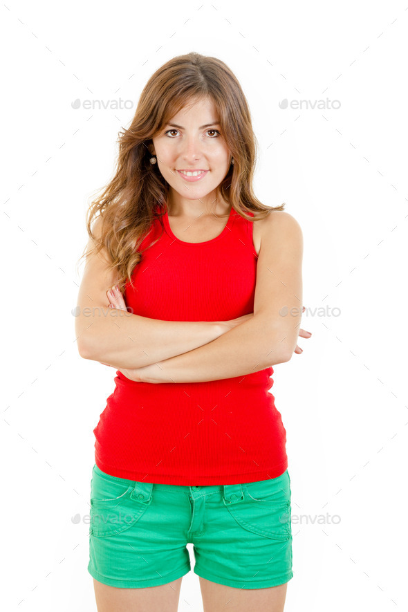 Cute teenage girl standing in casual clothes with arms crossed (Misc) Photo Download