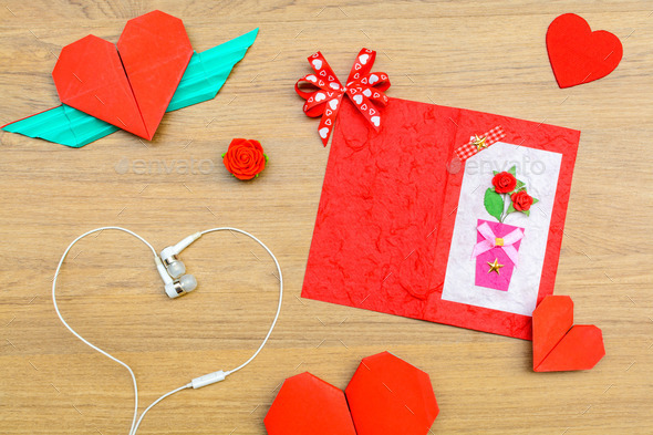 Red heart shape paper on wooden table (Misc) Photo Download