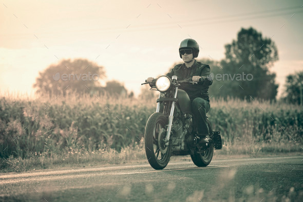 Biker riding in the sunset (Misc) Photo Download