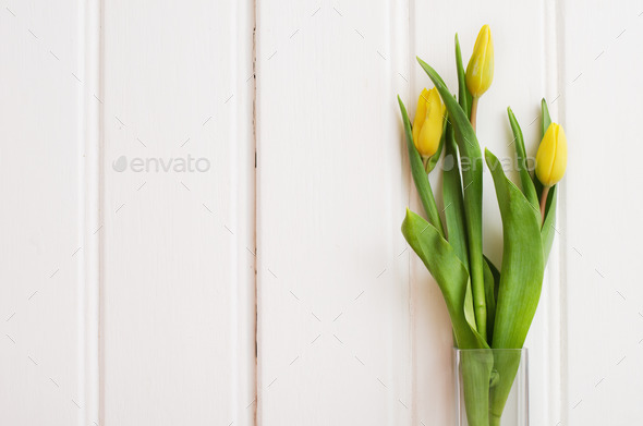 Bouquet of yellow tulips in a glass vase (Misc) Photo Download