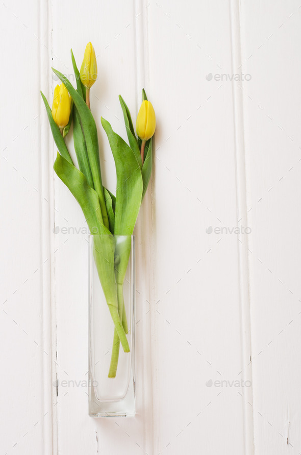 Bouquet of yellow tulips in a glass vase (Misc) Photo Download