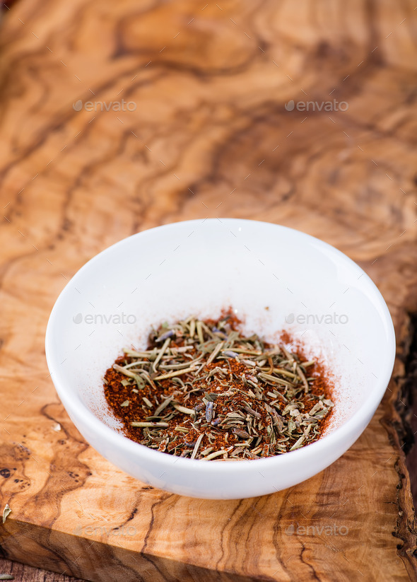 Mixed dried herbs with paprika in small bowl (Misc) Photo Download