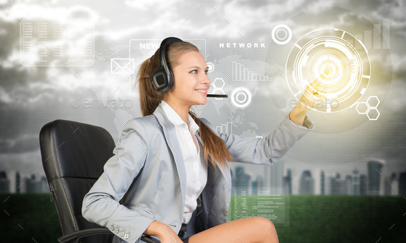 Businesswoman in headset using virtual interface
