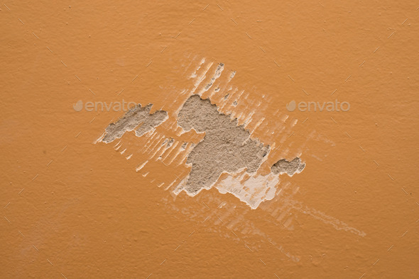 Mark of paint scraper on wall