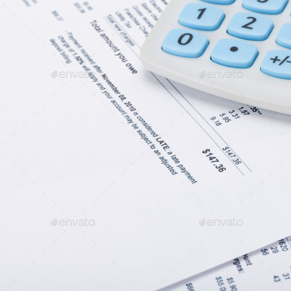 Receipt with calculator next to it (Misc) Photo Download