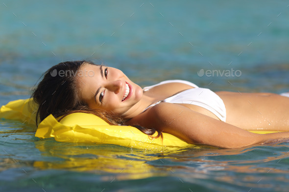 Tourist woman bathing in a tropical sea