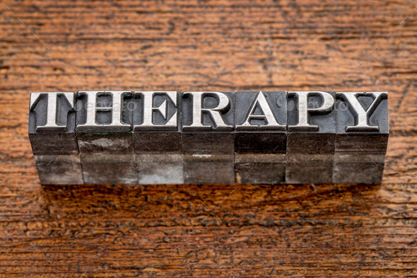 therapy word in metal type