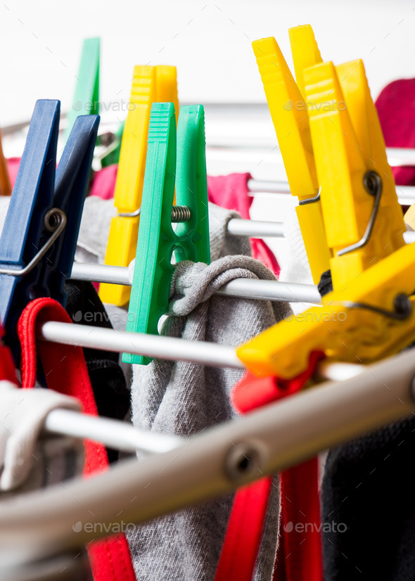 mixed clean laundry pinned with colourful clothespins (Misc) Photo Download