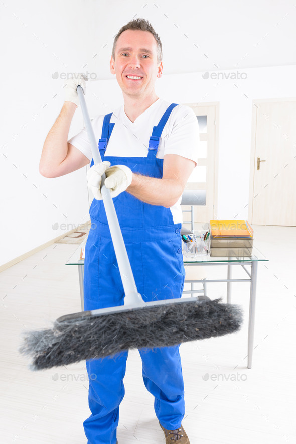 Smiling cleaner at the office (Misc) Photo Download