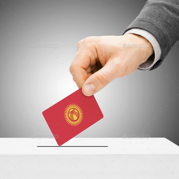 Voting concept - Male inserting flag into ballot box - Kyrgyzsta (Misc) Photo Download