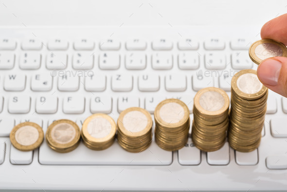 Close-up Of Person Stacking Coins (Misc) Photo Download