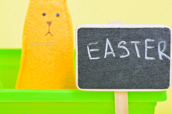 Blackboard with easter bunny on the background (Misc) Photo Download