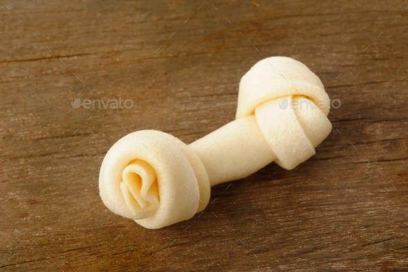 Bone toy for dogs on wooden background