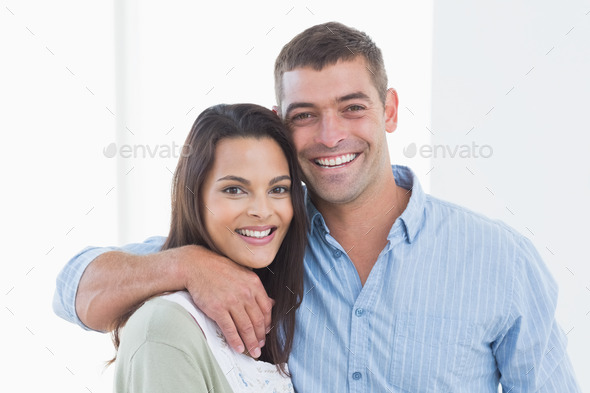 Portrait of loving couple smiling at home (Misc) Photo Download