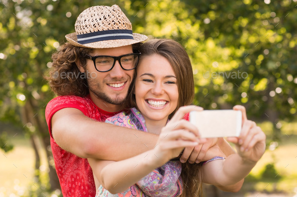 Friends taking a selfie in the park on a sunny day (Misc) Photo Download