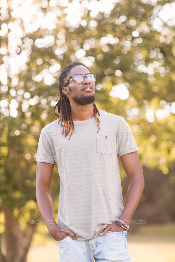 Handsome hipster in the park on a sunny day (Misc) Photo Download