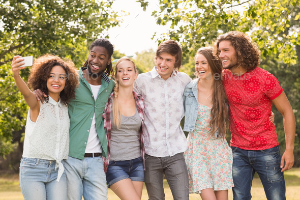 Happy friends in the park taking selfie on a sunny day (Misc) Photo Download