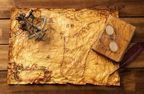 Sextant, old book and glasses on vintage map over wooden background (Misc) Photo Download