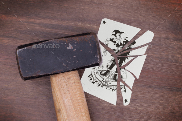 Hammer with a broken card, joker