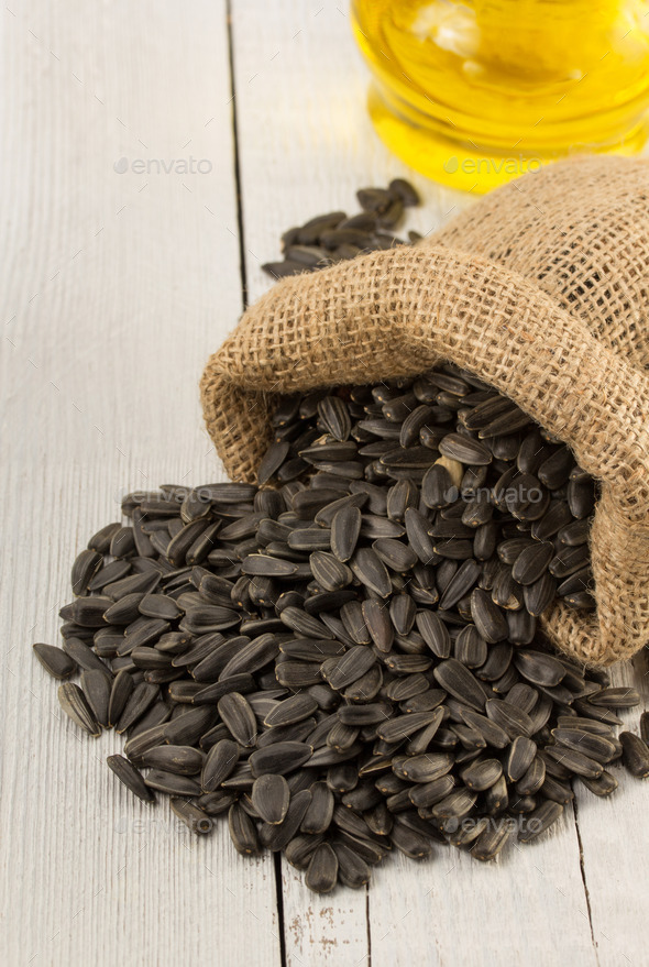 sunflower oil and seeds on wood (Misc) Photo Download