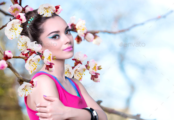 Girl in a Pink Shirt with Spring Flowers. (Misc) Photo Download