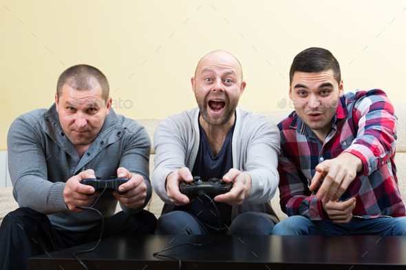 Three friends playing video games