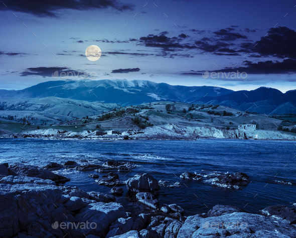 village near lake in mountains at night (Misc) Photo Download