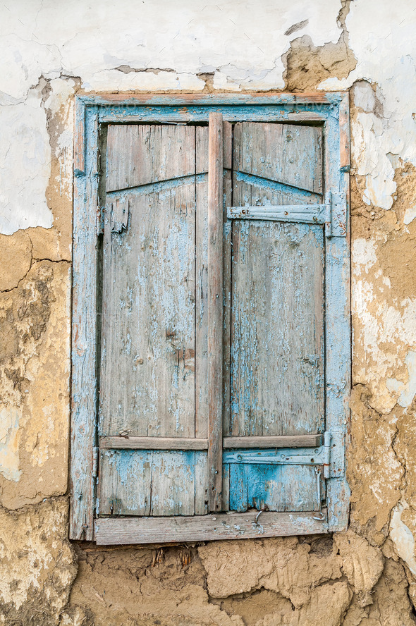 Old wooden window shutters on the background of the destroyed wa (Misc) Photo Download