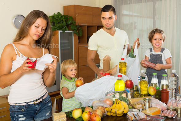 Poor family with bags of food