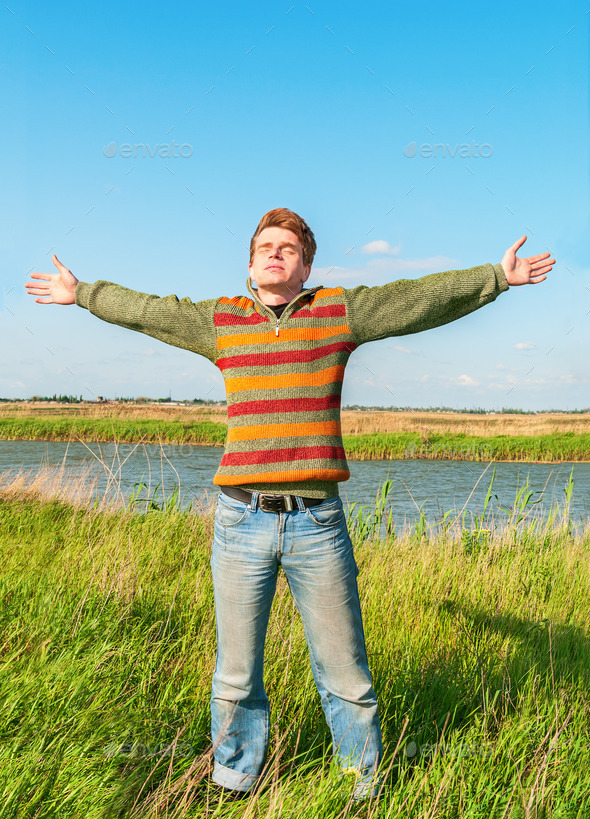 Young man having happy time in nature (Misc) Photo Download