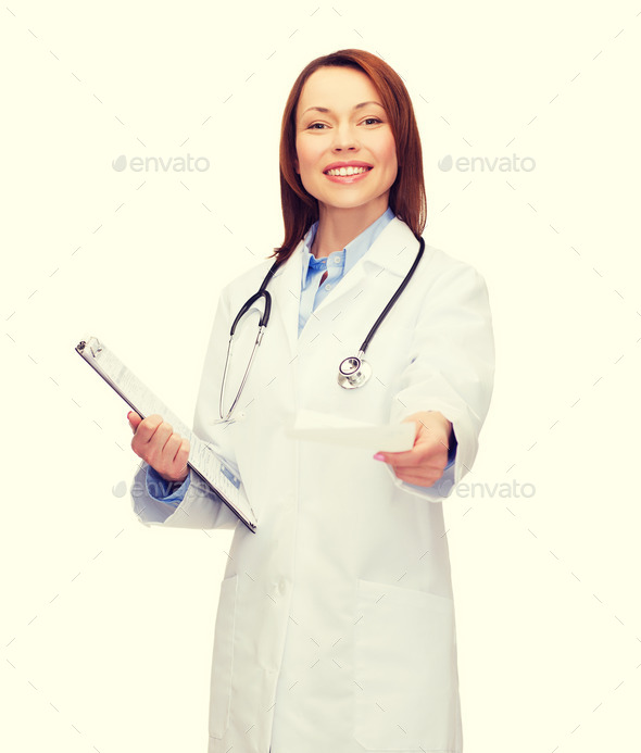 smiling female doctor with clipboard (Misc) Photo Download