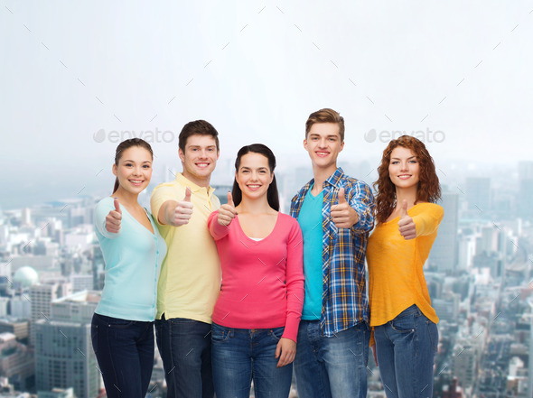 group of smiling teenagers over city background (Misc) Photo Download