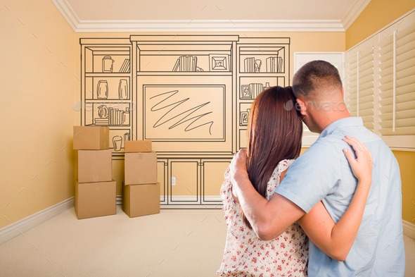 Hugging Military Couple In Empty Room with Shelf Design Drawing on Wall. (Misc) Photo Download