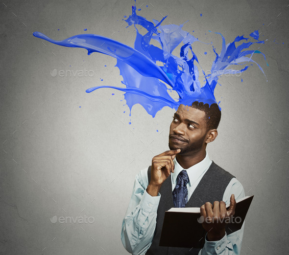 Man reading book colorful splashes coming out of head (Misc) Photo Download