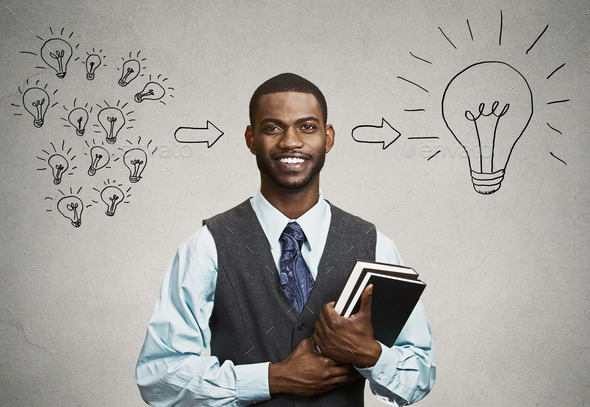 Confident young man, student holding books has big ideas (Misc) Photo Download