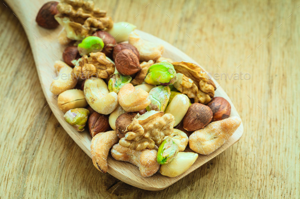 Varieties of nuts: cashew, pistachio, almond.