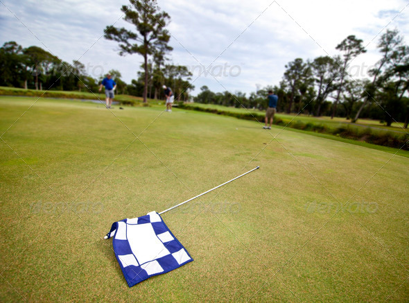 golf flag and players