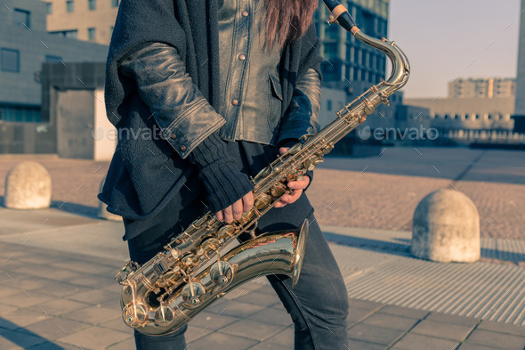 Detail of a young woman with her saxophone (Misc) Photo Download