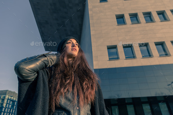 Beautiful young woman posing in the city streets (Misc) Photo Download